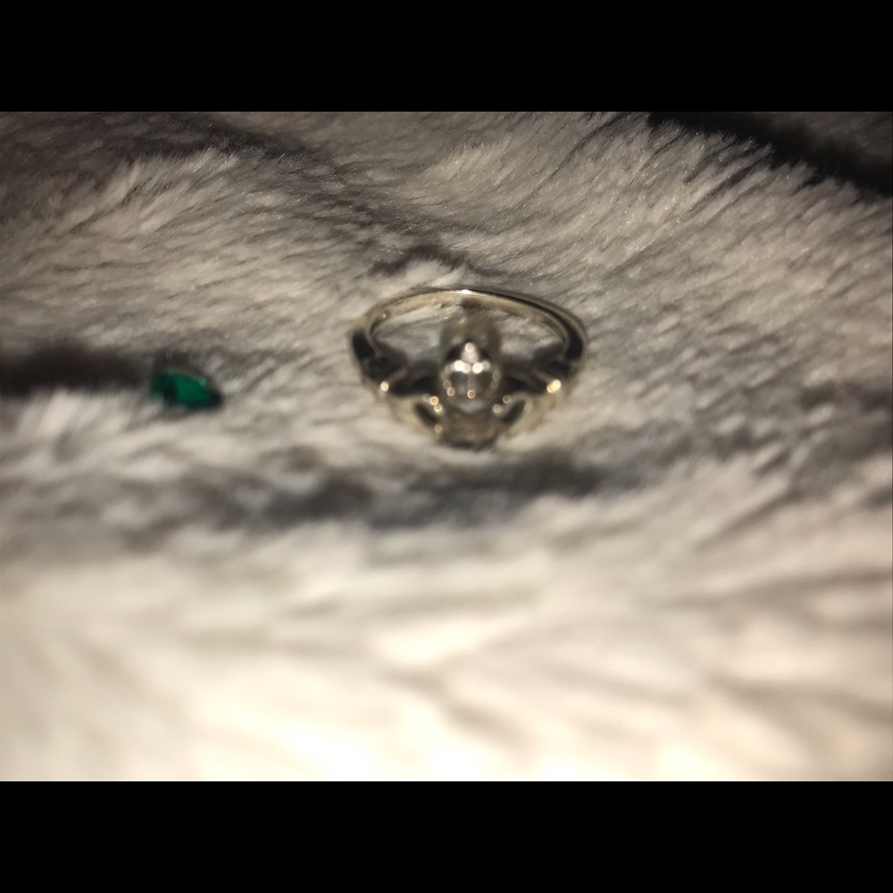 Stamped 925 sterling silver Claddagh Ring, heart shaped emerald cut stone